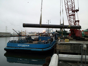 The Alaska Marine Lines’ crew loads the M/V Sovereign at the Seattle dock. 