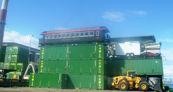 A newly constructed parlor car perched atop Alaska Marine Lines’ containers 