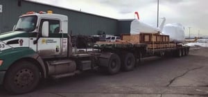 Helicopter fuselage loaded on truck in Anchorage